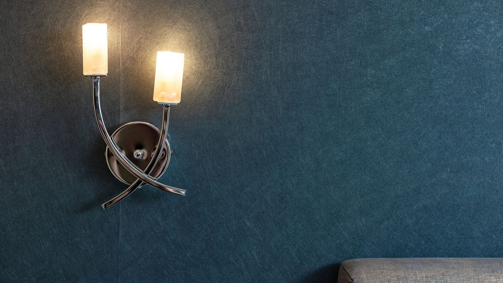 A wall lamp at dusk